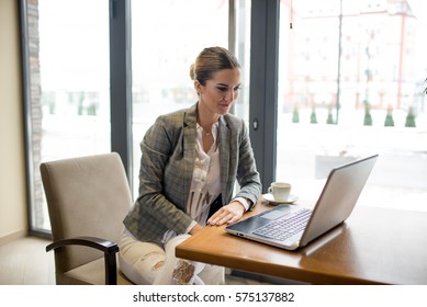 Bussines Woman Is Sitting In Front Of Laptop