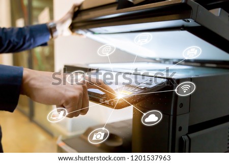 Bussiness man Hand press button on panel of printer with icon technology printer scanner laser office copy machine supplies start concept.