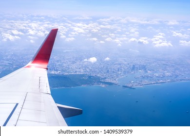 Bussiness And Travel Concept. Aerial View Through Window Inside Aircraft Cabin With Beautiful Blue Sky And Cloud With Sunlight, Copy Space, Top View