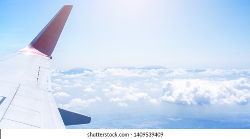 Bussiness And Travel Concept. Aerial View Through Window Inside Aircraft Cabin With Beautiful Blue Sky And Cloud With Sunlight, Copy Space, Top View