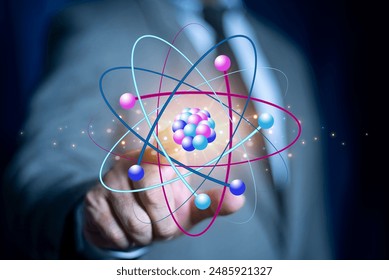 Bussinessman hand holding creative atom on blue background. Nuclear fusion concept, endless energy, cheap electricity, future technologies. Science and future concept  - Powered by Shutterstock