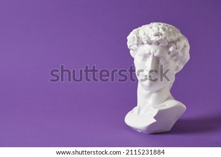 bust of david replica on purple background copy space, copy of work by michelangelo 商業照片 © 