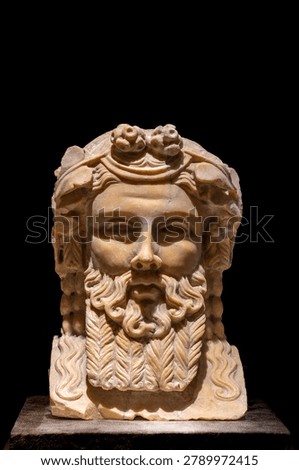 The bust of Dionysus on a small square column unearthed from Pompeii, Italy