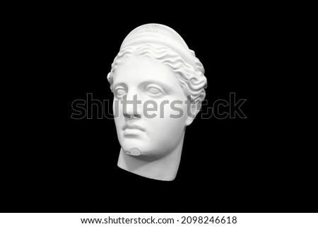 bust head of a woman made of plaster cast isolated on black background. three-quarter position. High quality photo