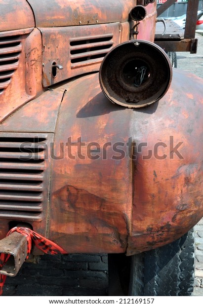 Busted lamp in a rusty\
truck