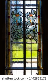 BUSTENI, ROMANIA - JUNE 14, 2019. Stained Glass With The Royal Insignia Of The Cantacuzino Family. Indoor Of Cantacuzino Palace In Neo-romanian Style