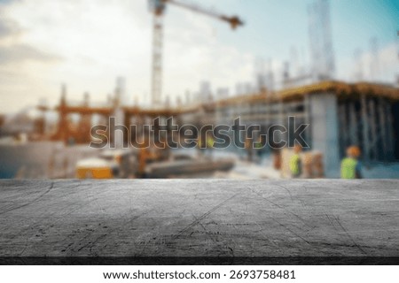 A bustling construction site features workers in safety gear, machinery, and a partially built structure under construction. The scene captures the energy of daytime work.