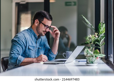 Busy adult man, thinking about his new project, and working on it. - Shutterstock ID 2144697483