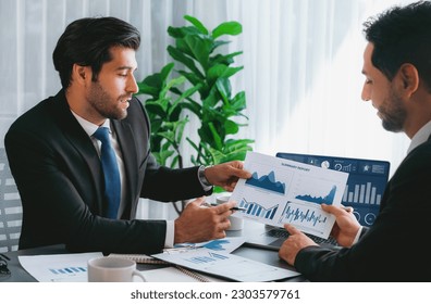 Busy analyst team discussing financial data digital dashboard  analyzing chart   graph using data science software display laptop screen  Business intelligence   Fintech  Fervent