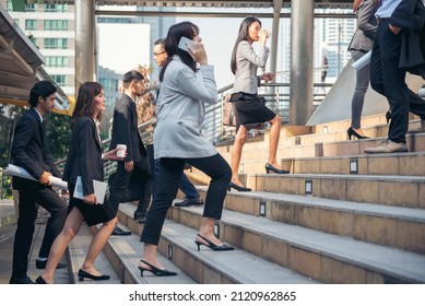 Busy asian people hurry city lifestyle. Crowd asian business people walking go to work in modern urban city office. Group of asian business people busy life urban street. Business People lifestyle