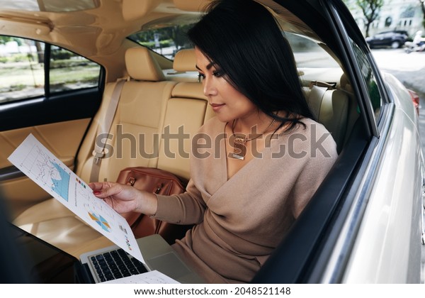 Busy Asian Woman In\
Car