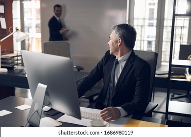 Busy boss is preparing for meeting in office stock photo. Business concept - Shutterstock ID 1686980119