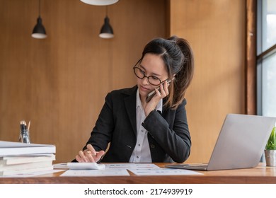 Busy business accountant woman making call phone in office and business working background, tax, accounting, statistics and analytic research concept - Shutterstock ID 2174939919