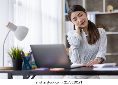 Busy Business Asian Woman Sad, Tired Or Exhausted At Office. Stressful Work, Stress At Workplace. Busy Business Asian Woman, Project Failure, Workaholic. Unhappy Female Clerk Sitting At Desk. 