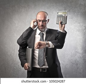 Busy Businessman With Four Arms