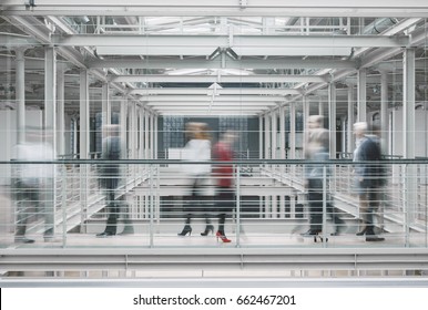 Busy Businesspeople In Hurry Working In Big Modern Factory