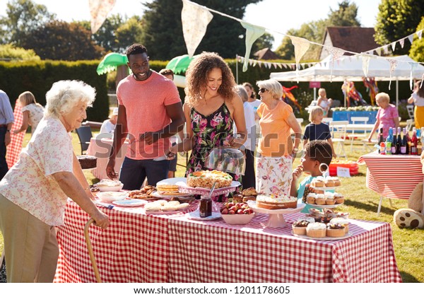 Busy Cake Stall At\
Summer Garden Fete