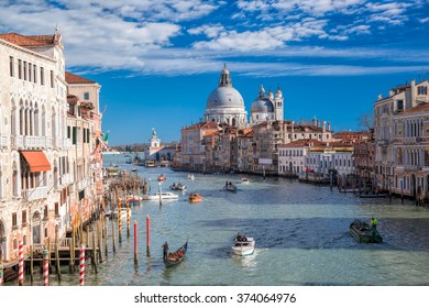  Busy Canal Grande with Basilica di Santa Maria della Salute in Venice, Italy