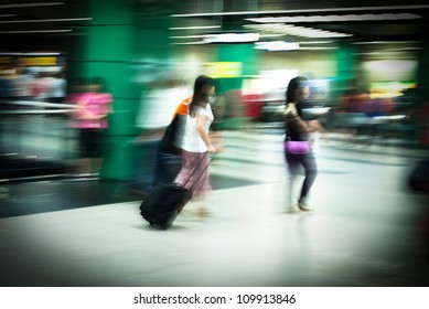 Busy City People Walking In Subway Station In Motion Blur