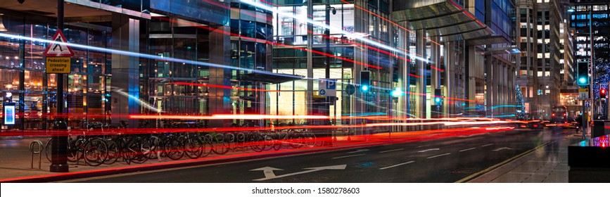 Busy City Street At Night With Light Streaks From Vehicles Panoramic