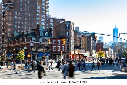 Busy Crowds Of People Walking Across The Street At 7th Avenue In The Greenwich Village Neighborhood Of New York City NYC