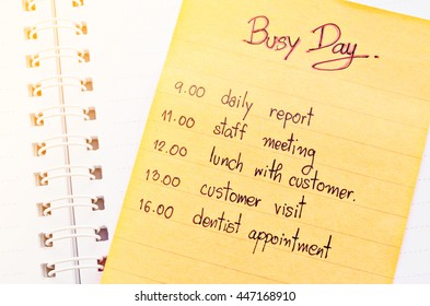 Busy Day Appointment Business Schedule In Note Paper On Open Diary.