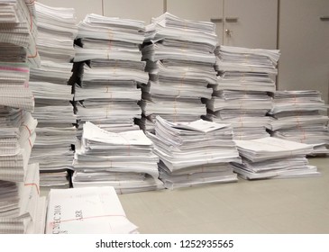 Busy day. Stack of paper document waiting queue for inspection. Hard working concept. Work to dead. Copy space for text. 