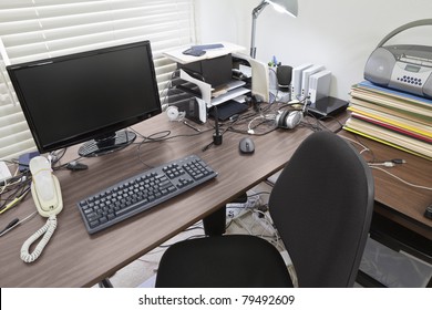 Busy Desk In A Bright Home Office.