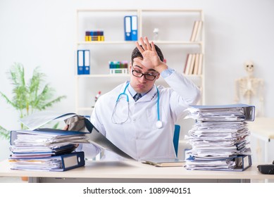 Busy Doctor With Too Much Work In Hospital