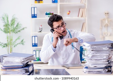 Busy Doctor With Too Much Work In Hospital