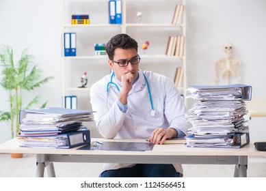 Busy Doctor With Too Much Work In Hospital