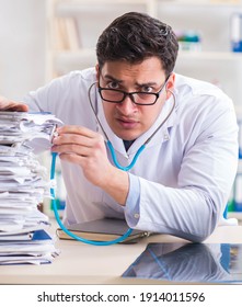 Busy Doctor With Too Much Work In Hospital