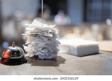 Busy Evening Shift at a Restaurant With Piled-Up Order Tickets on the Counter - Powered by Shutterstock