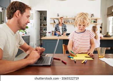 Busy Family Kitchen, Dad And Son Working At Table, Close Up