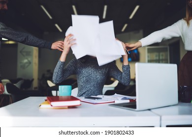 Busy Female Company Worker Sitting At Desk With Laptop Notebooks And Smartphone And Hiding Behind Papers From Too Many Phone Calls And Paperwork