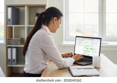 Busy female secretary at desk checks smart virtual electronic visual mockup memo Calendar Time Planner on laptop monitor, efficiently organizes day, week, month project list and urgent staff Schedule