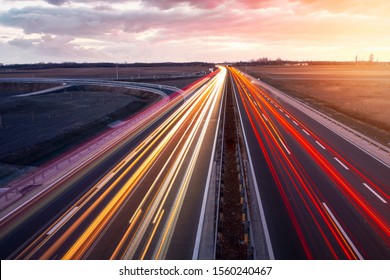 Busy highway with fast moving vehicles in beautiful sunset in Hungary