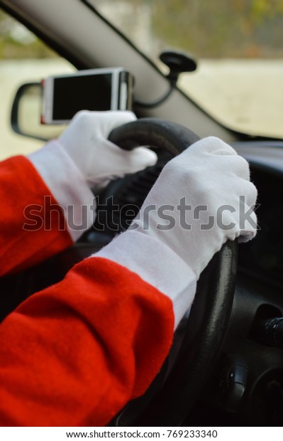Busy holiday time for Santa Claus driving\
vehicle carrying delivering presents celebrating joy happiness.\
Close up on person providing quick transportation service. Rushing\
people solution concept.