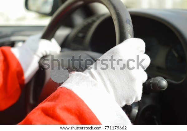 Busy holiday time for Santa Claus driving\
vehicle carrying delivering presents for celebrating happiness.\
Close up on person providing quick transportation service. Rushing\
people solution concept.