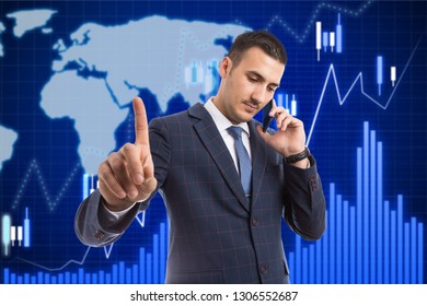 Busy Male Broker Talking On The Phone Holding Index Finger Up As Do Not Disturb Gesture