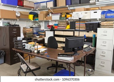 Busy Messy Back Office With Piles Of Files And Storage Boxes.