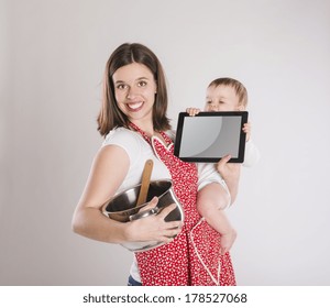 Busy Mother And Baby With Digital Tablet.