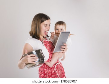 Busy mother and baby with digital tablet. - Powered by Shutterstock