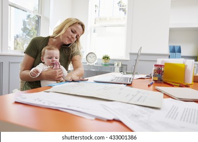 Busy Mother With Baby Running Business From Home