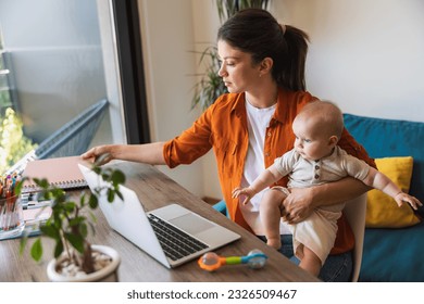 Busy mother babysitting her daughter while working at home. - Powered by Shutterstock