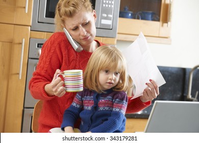 Busy Mother Coping With Stressful Day At Home