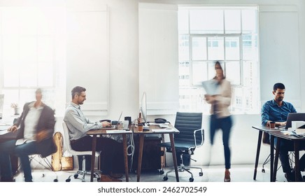 Busy, motion blur and work with business people in office for fast or professional productivity. Agency, collaboration and employee team walking in workplace for administration or project management - Powered by Shutterstock