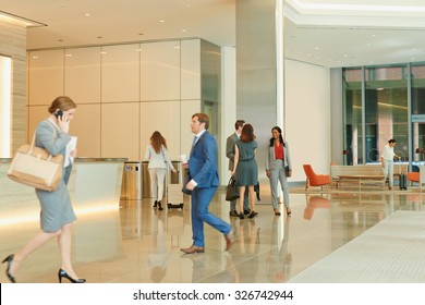 Busy Office Lobby With Business People Walking And Talking