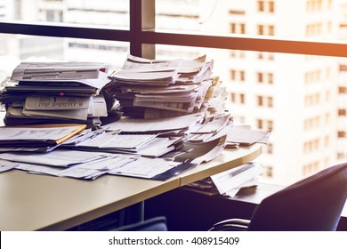 Busy Office With Stack Document On Table.