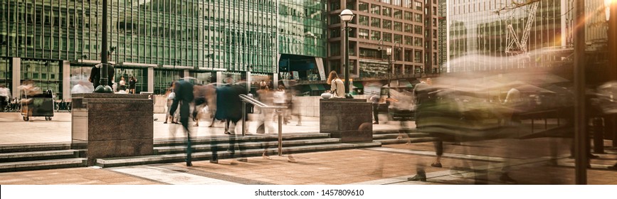 Busy Office Workers Commuting To Work Outside Modern Office Buildings